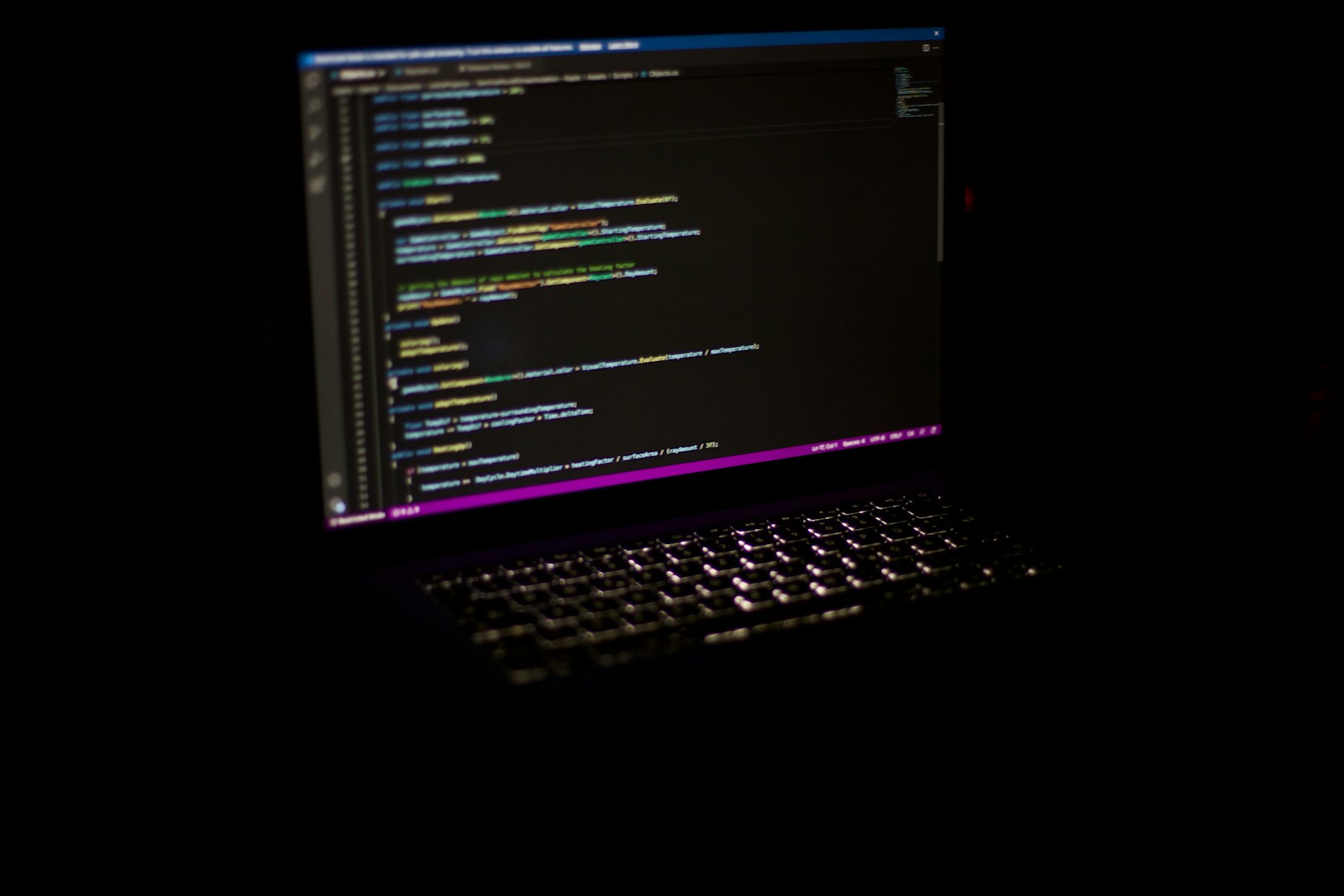 a laptop computer sitting on top of a table