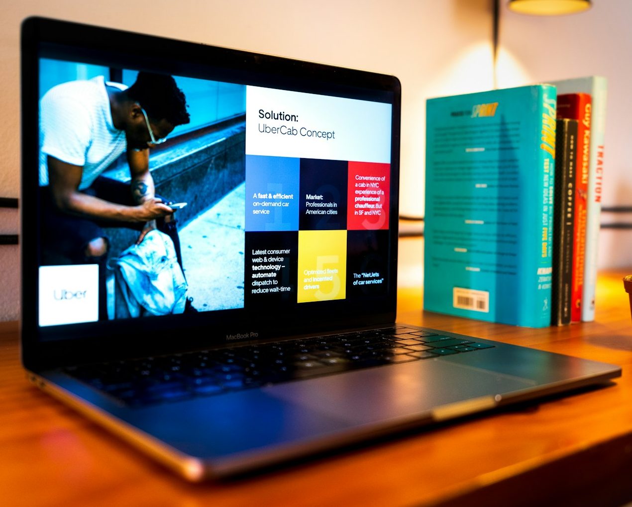 black laptop computer on brown wooden table